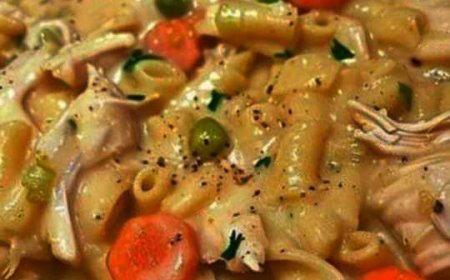 Skillet dish with chicken, noodles, and vegetables.