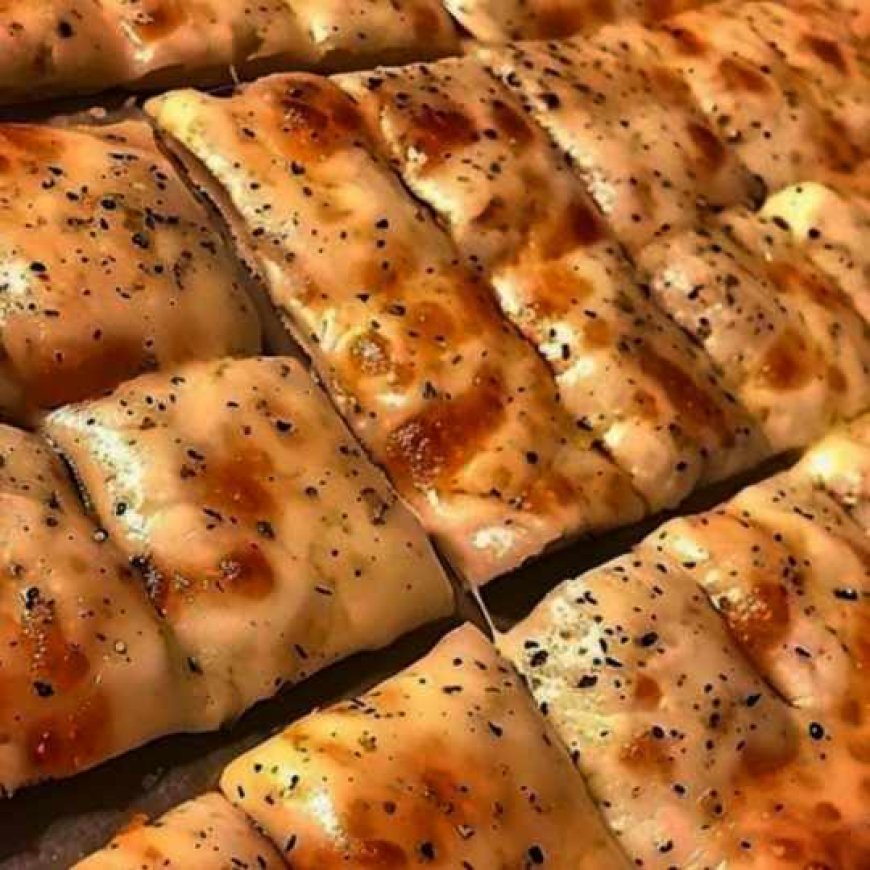 Breadsticks with cheese and garlic made at home.