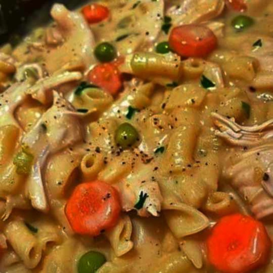 Skillet dish with chicken, noodles, and vegetables.