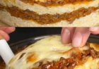 One hundred grams of grated hard mozzarella cheese